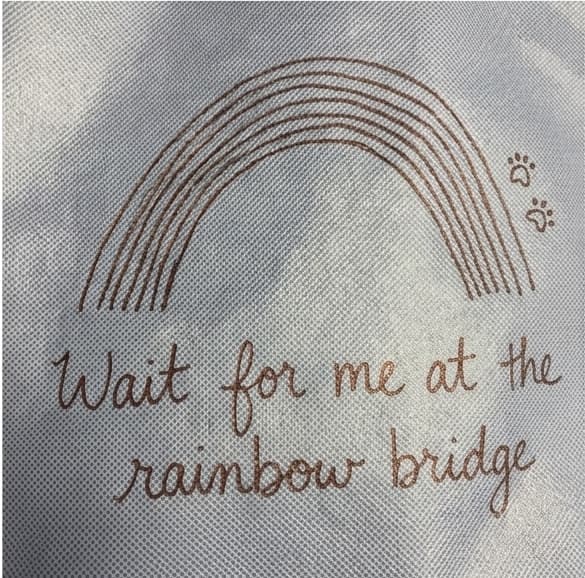 A CliniCareBag with a rainbow drawing and the words "Wait for me at the rainbow bridge"